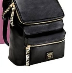 A versace bagpack. Black and golden